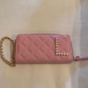 Pink quilted wristlet with pearl,  letter “L” on it. Never Used